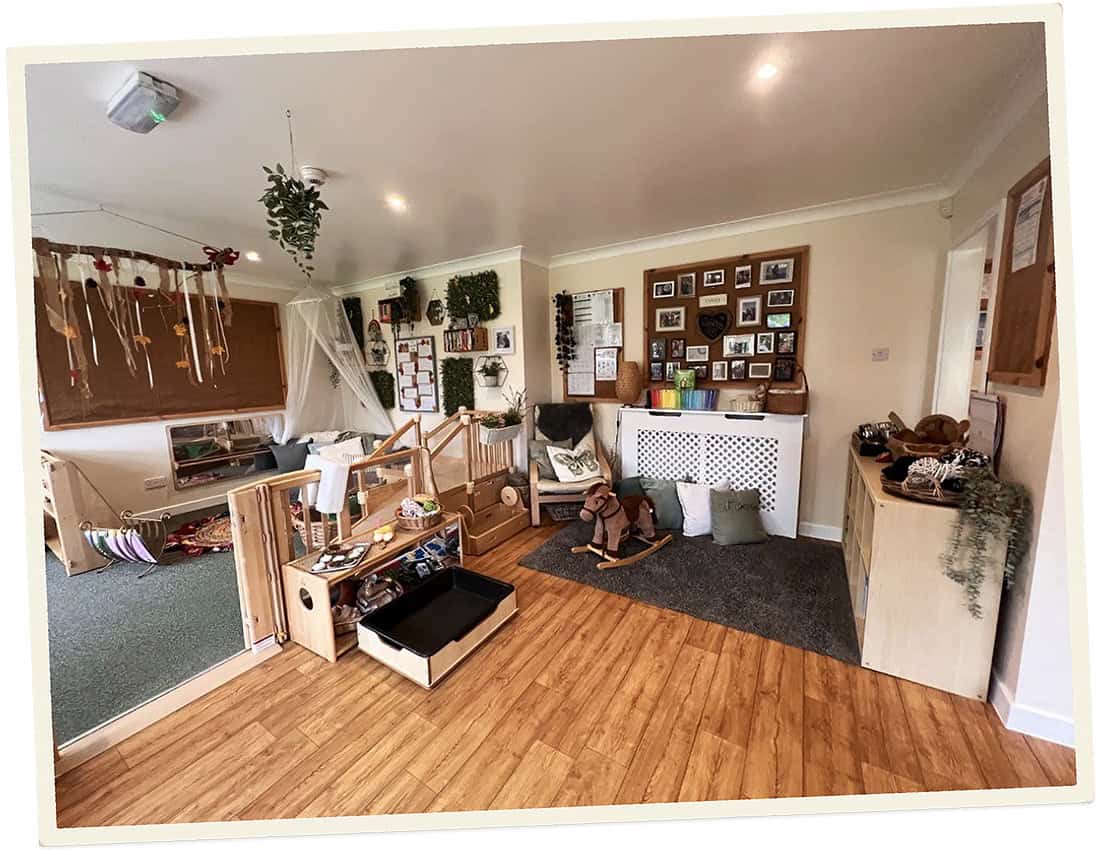 Indoor play area at Lancaster Lodge Childcare with toys and decorations.