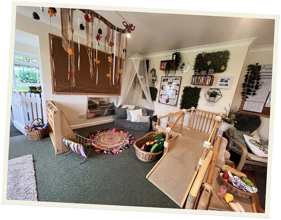 Indoor play area at Lancaster Lodge Childcare with toys and cozy seating.